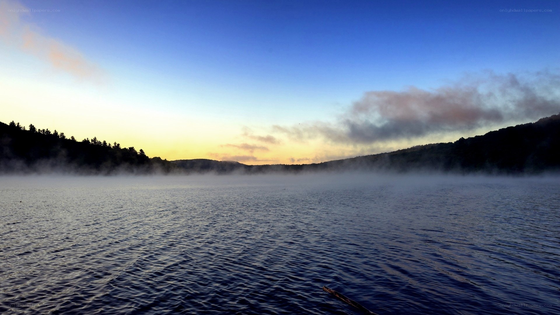Mist over a lake at dawn