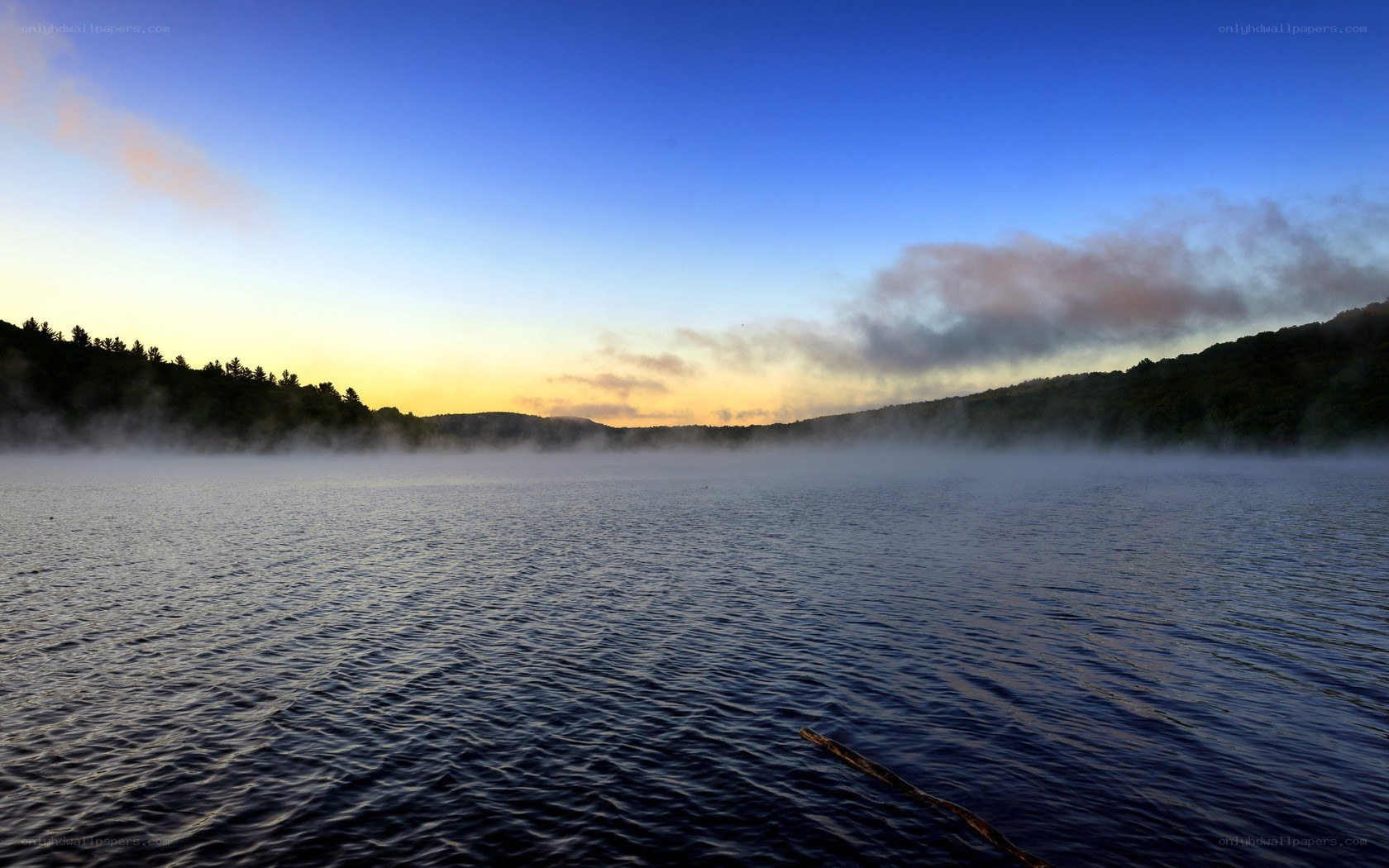 Mist over a lake at dawn