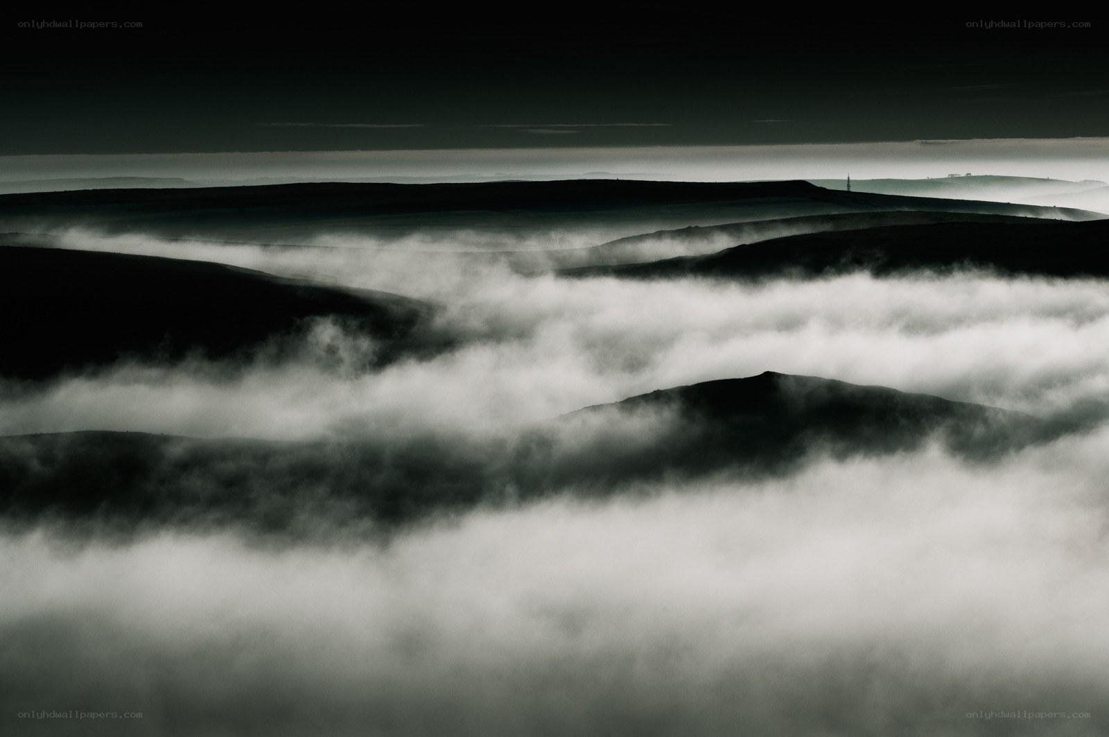 Mist over rolling hills