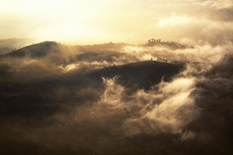 Mist over rolling hills