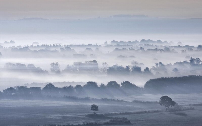 Mist over rolling hills