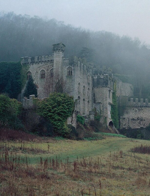Misty castle on a hillside