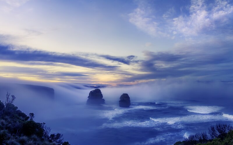 Misty coastal cliffs at dawn