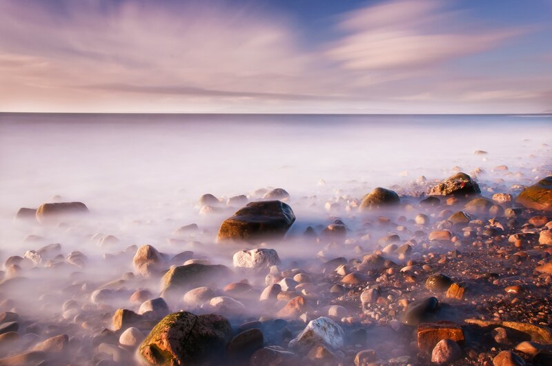 Misty coastal rocks at dawn