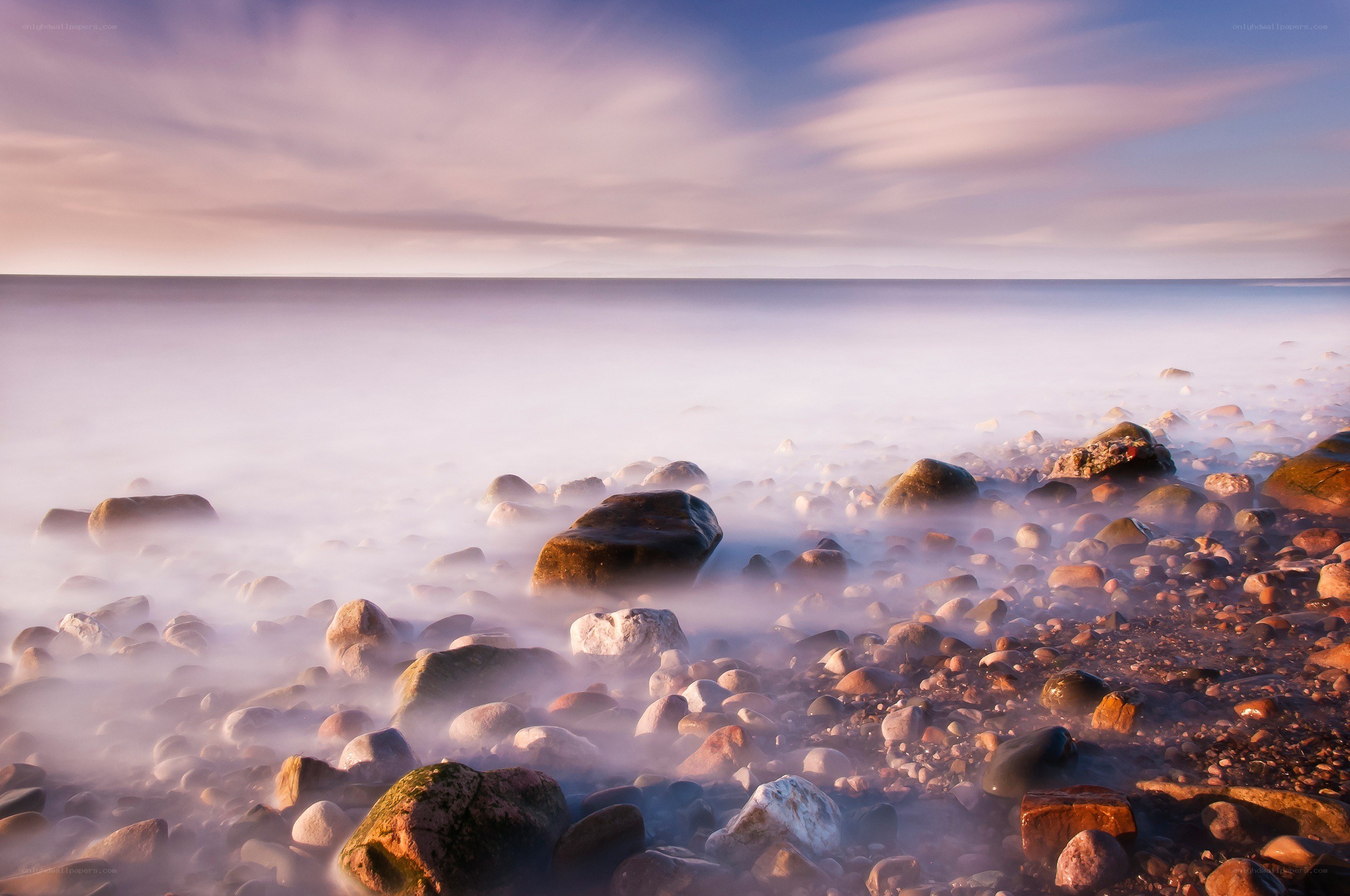 Misty coastal rocks at dawn