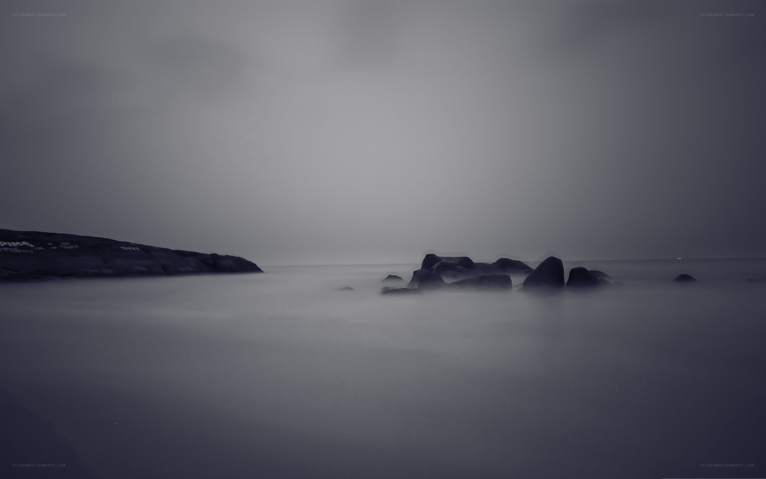Misty coastal rocks at dawn
