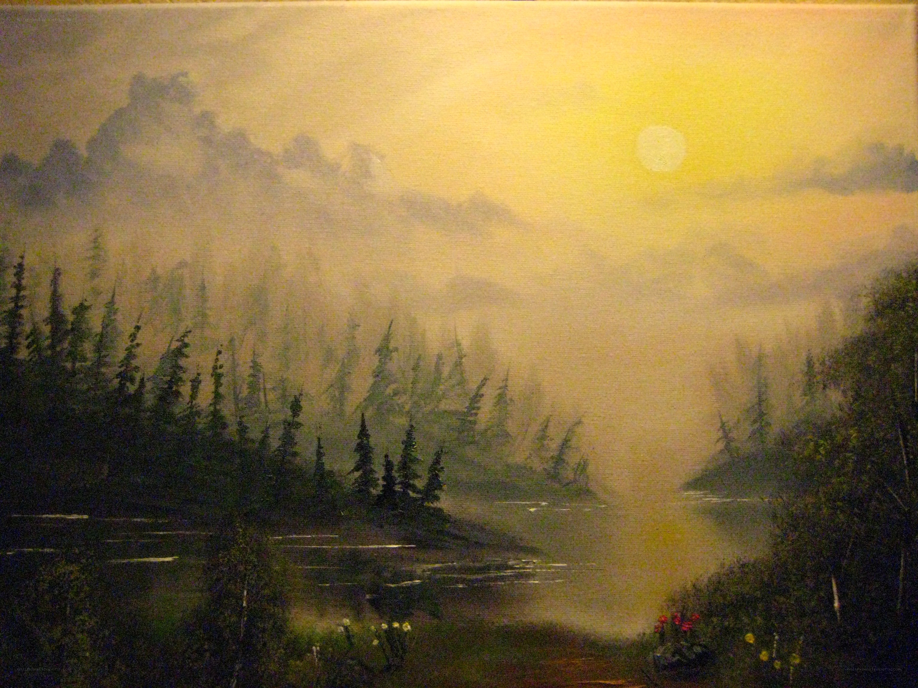 Misty forest lake at sunrise