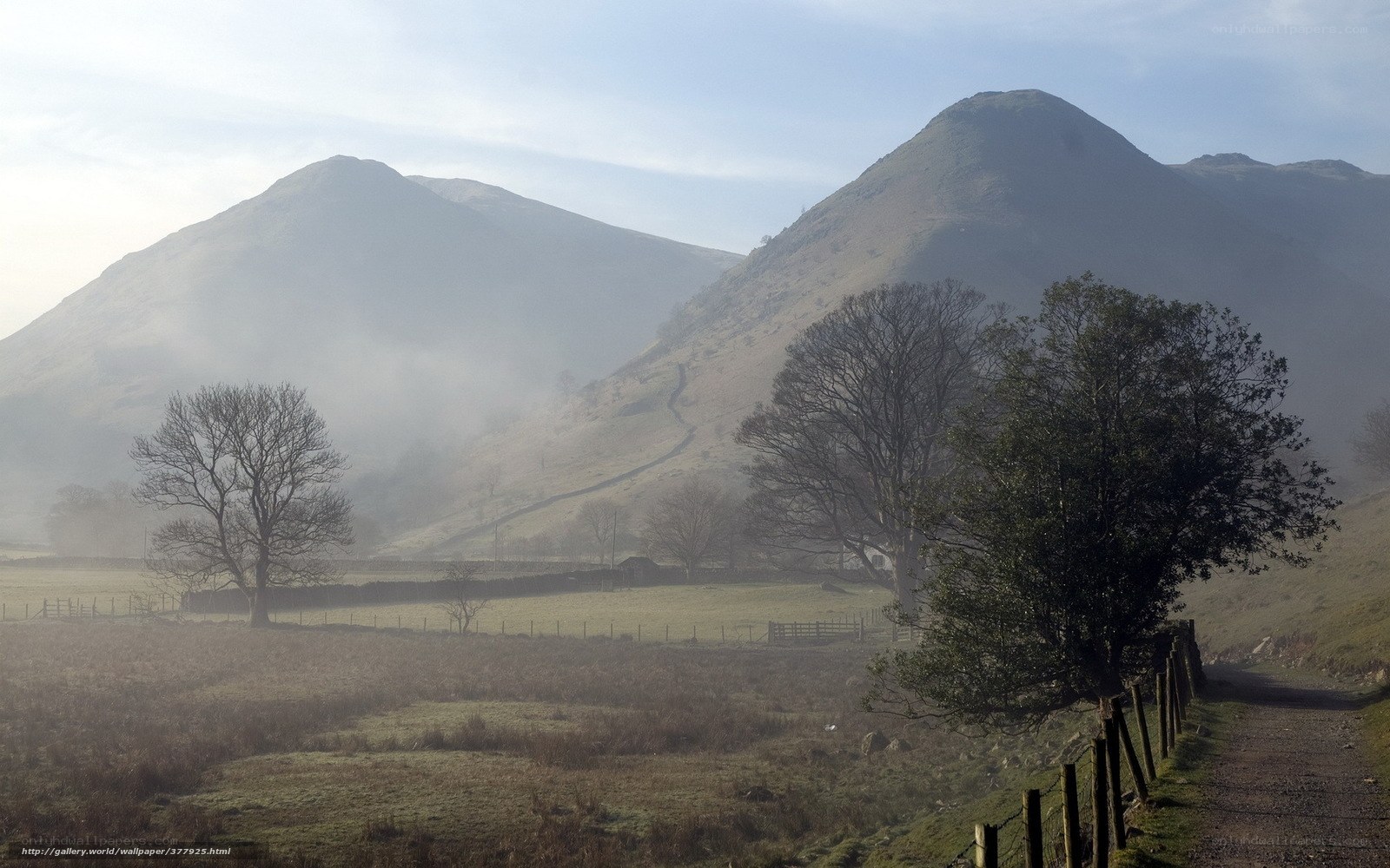 Misty hills and rural path