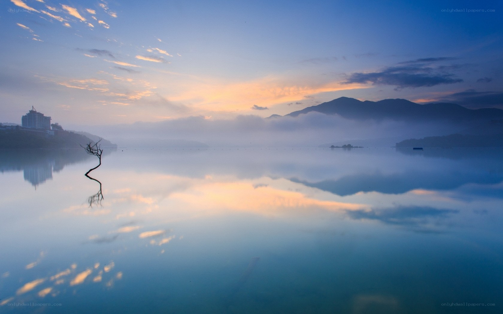 Misty lake at sunrise