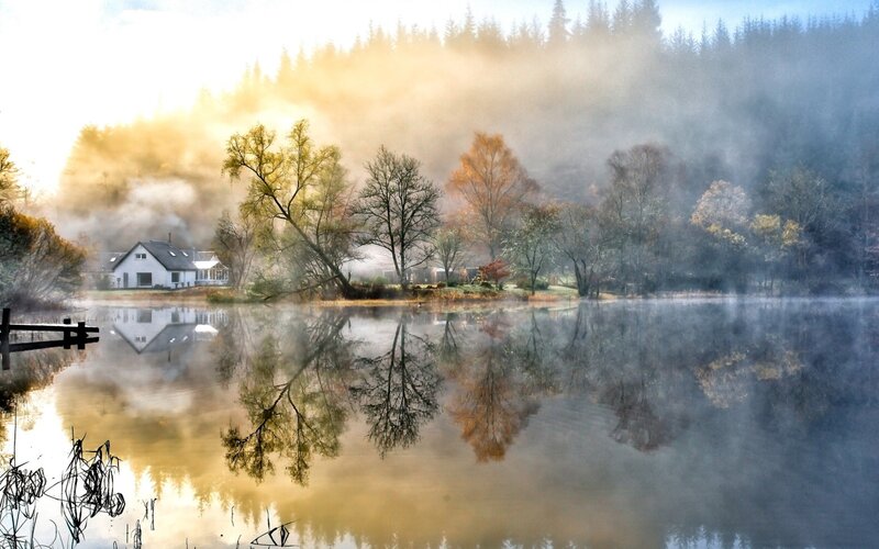 Misty lake at sunrise