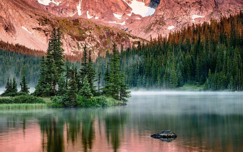 Misty lake at sunrise