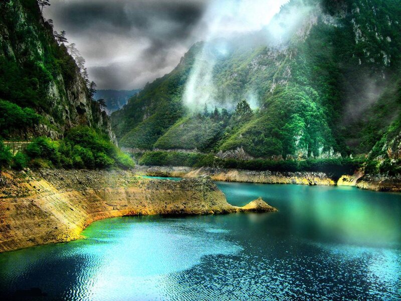 Misty lake in a mountain valley