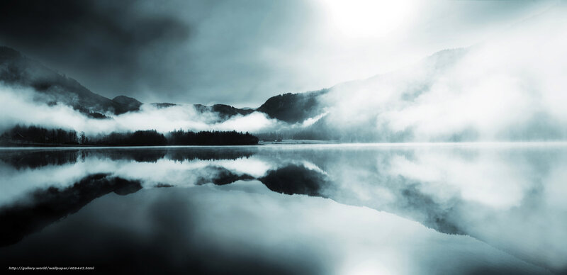 Misty lake in mountain valley