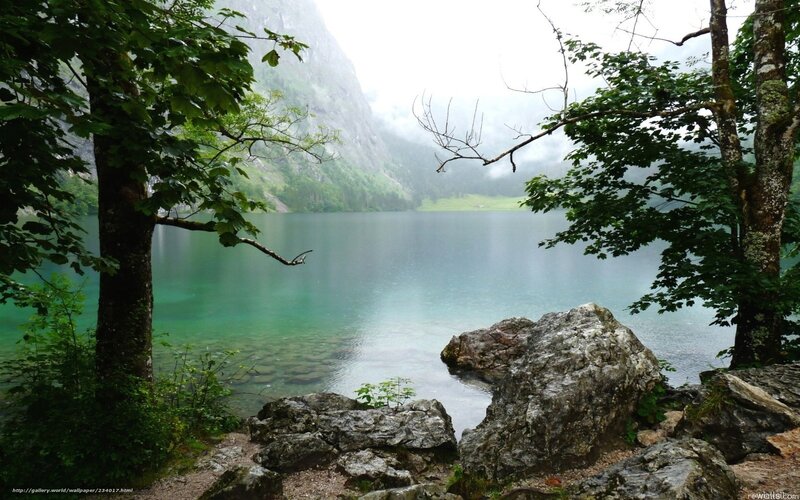 Misty lake in mountain valley