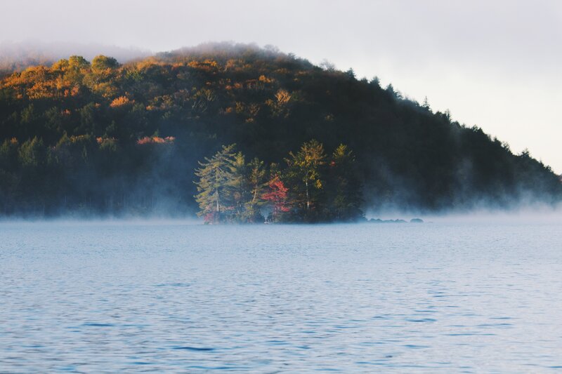 Misty Lake with Forested Hill
