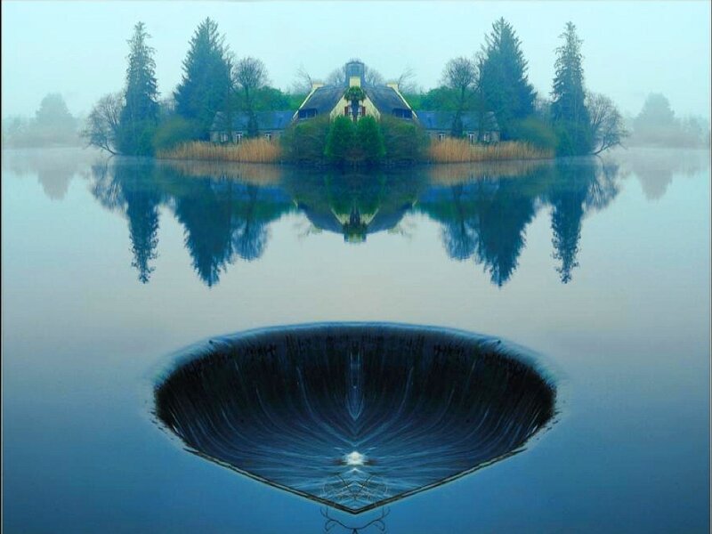 Misty lake with house reflection