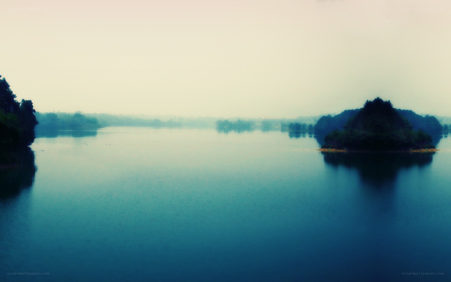 misty lake with islands