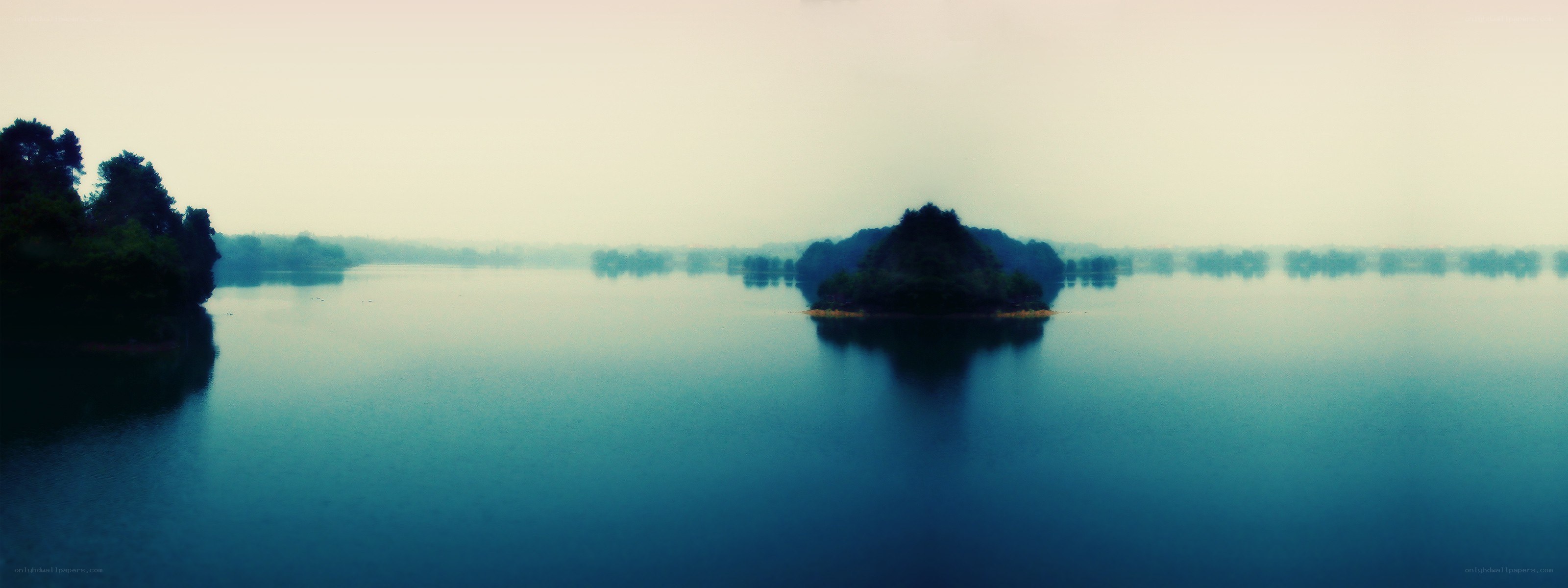 misty lake with islands