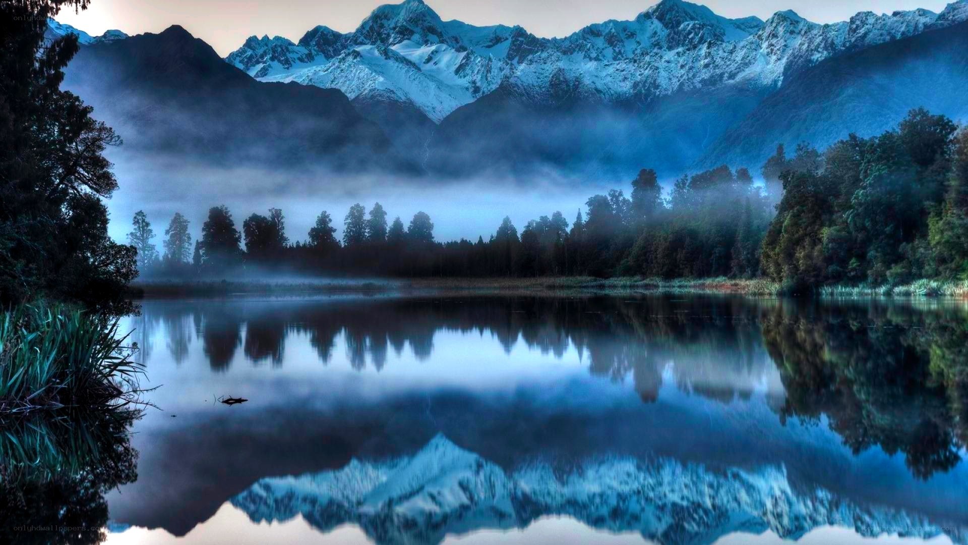 Misty lake with mountain reflection