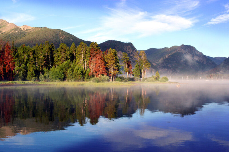Misty lake with mountain reflection