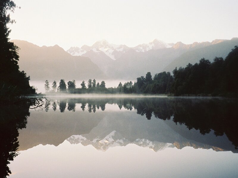 Misty lake with mountain reflection
