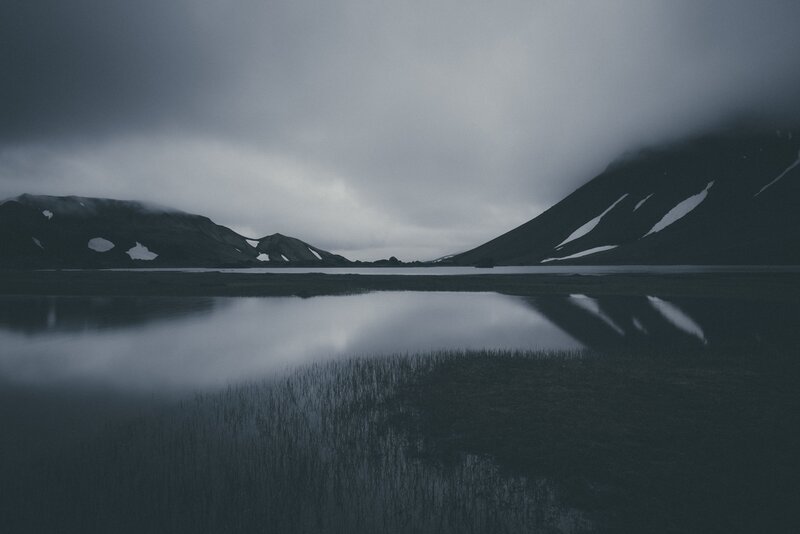 Misty lake with mountain reflections