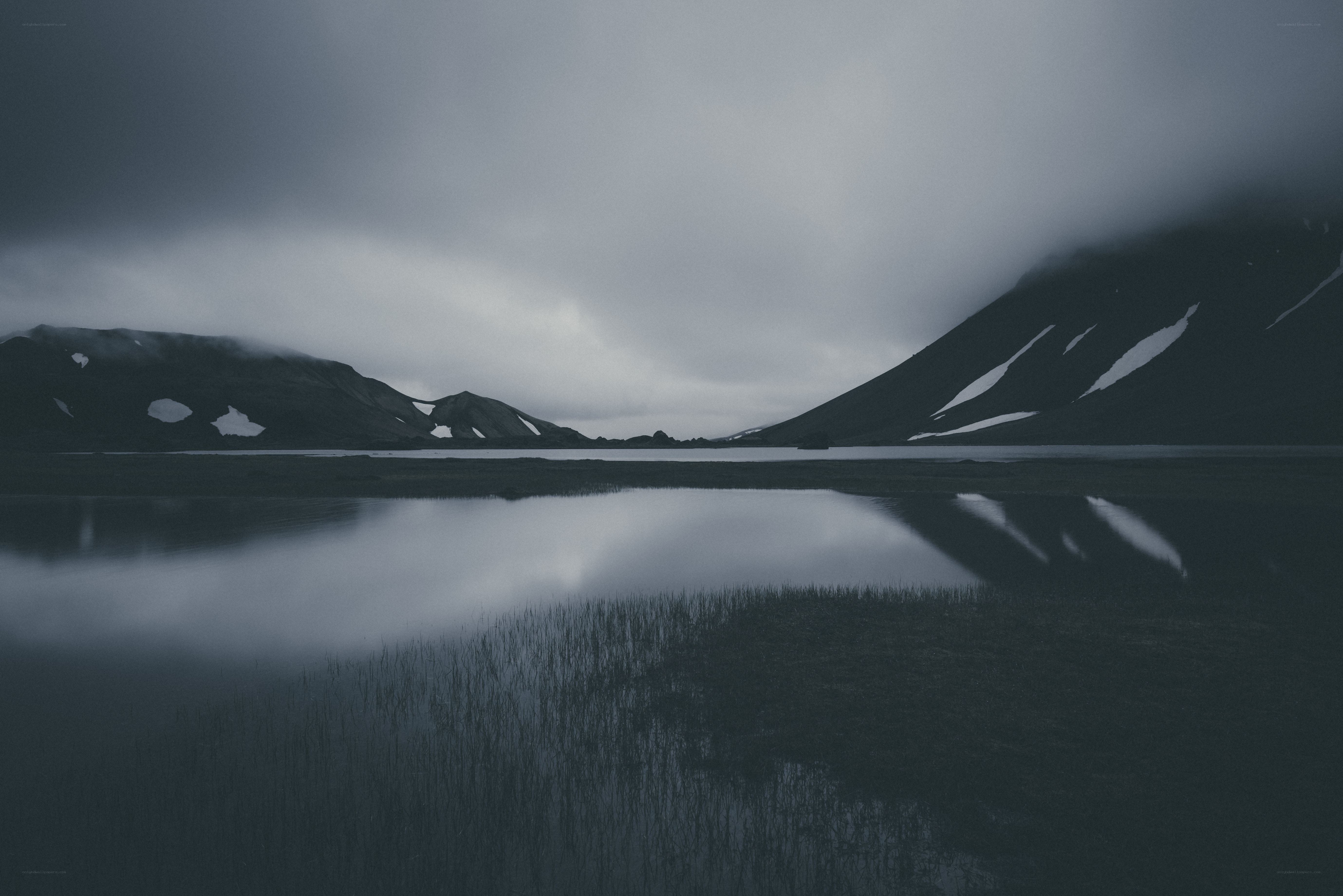 Misty lake with mountain reflections