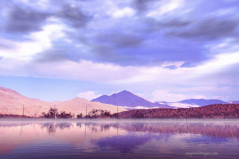 Misty lake with mountains