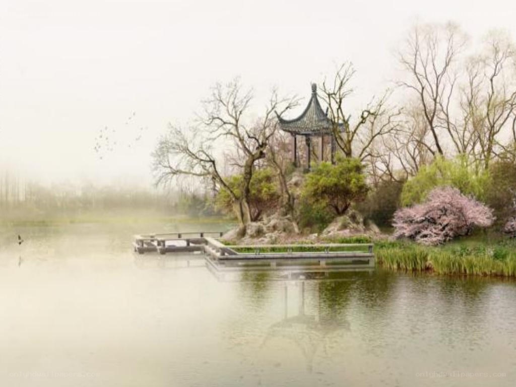 Misty lake with pavilion