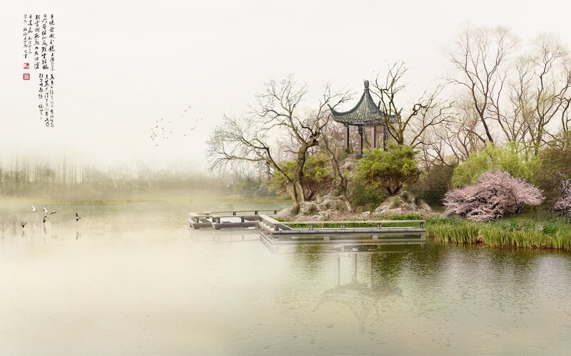 Misty lake with pavilion