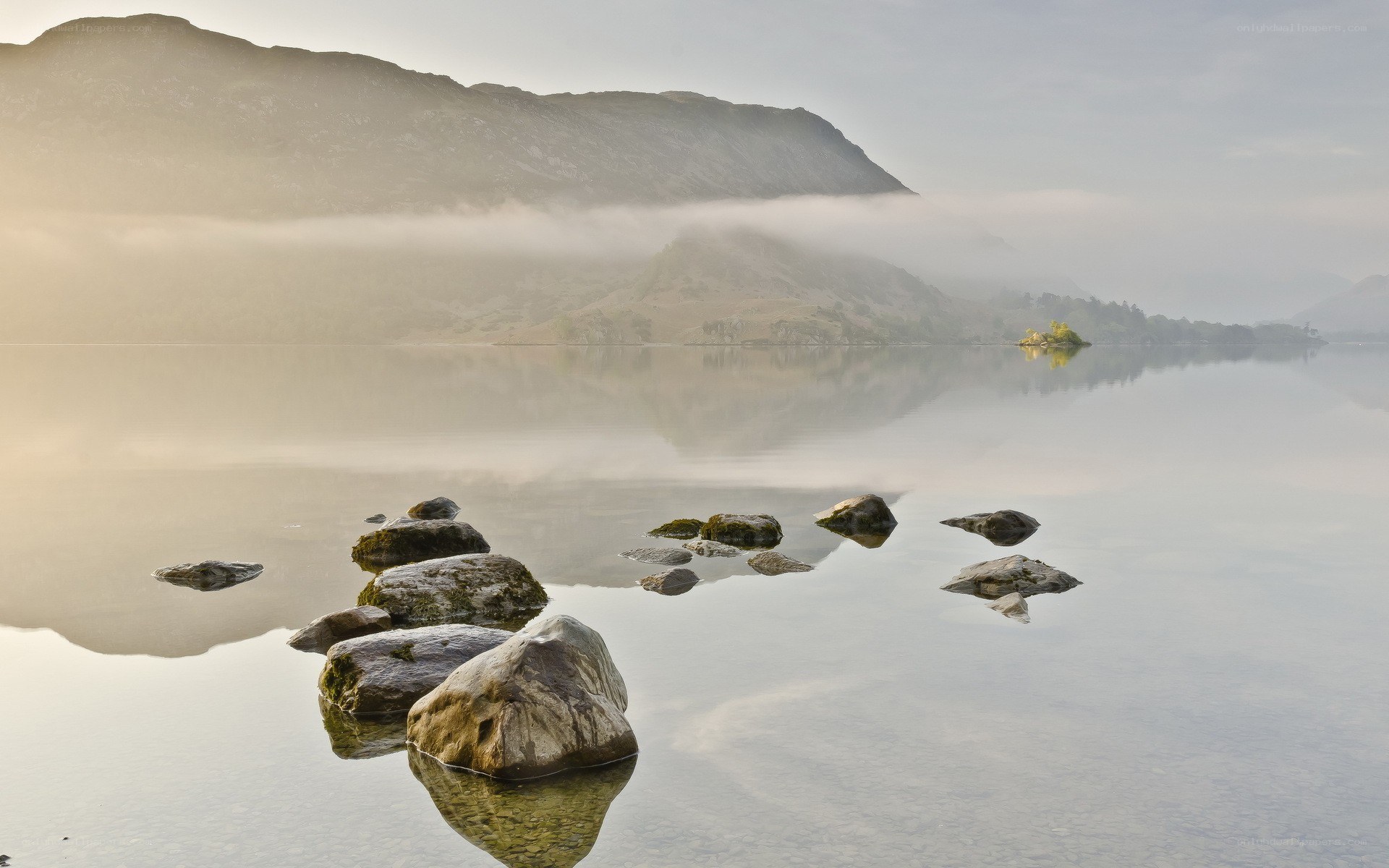 Misty lake with rocks
