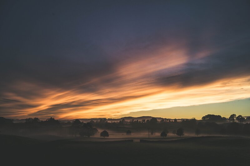 Misty Landscape at Sunrise