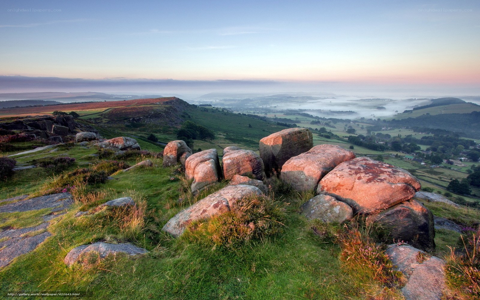 Misty morning over rolling hills