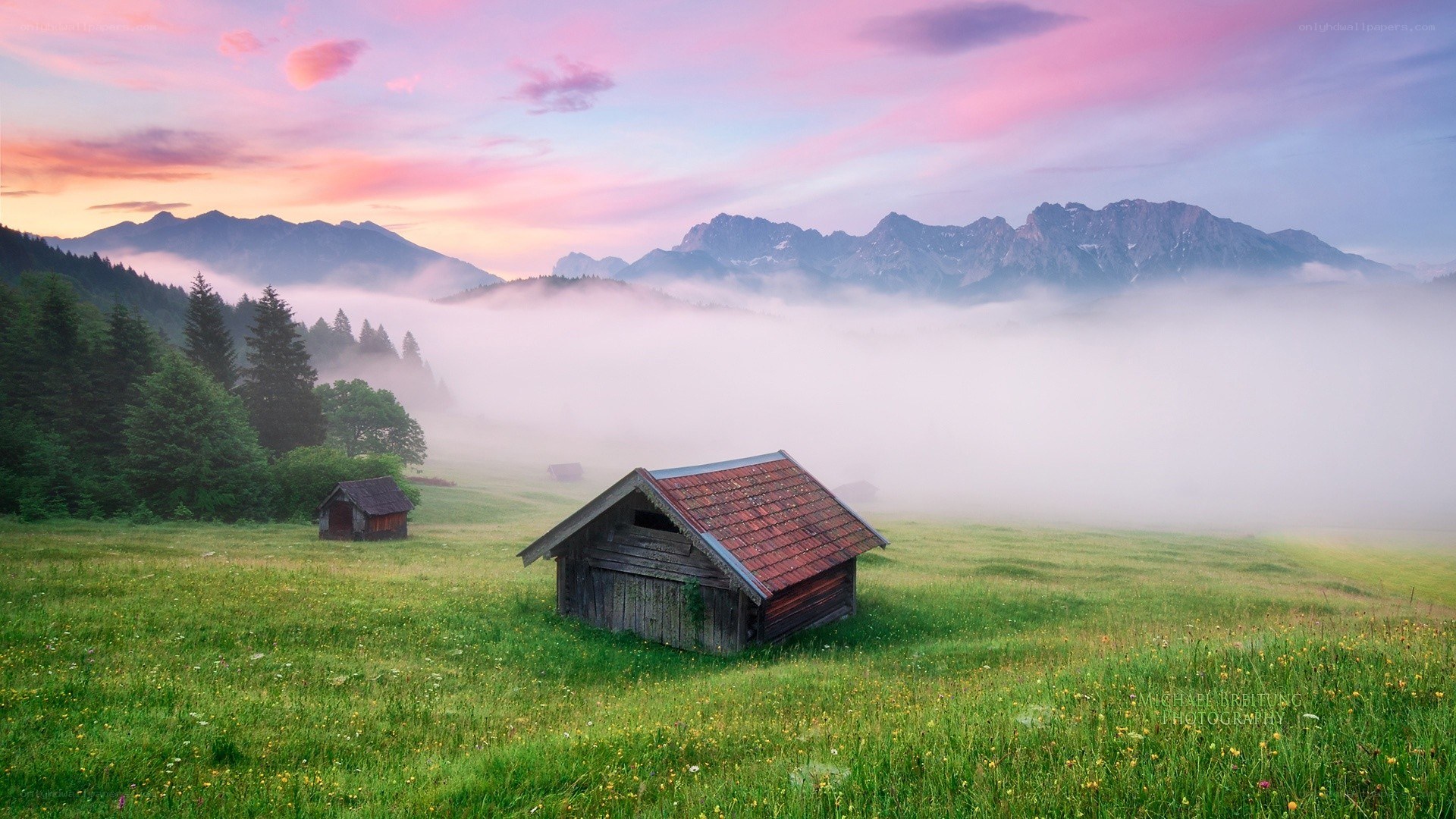 Misty mountain cabin at dawn