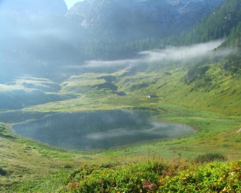 Misty mountain lake at dawn