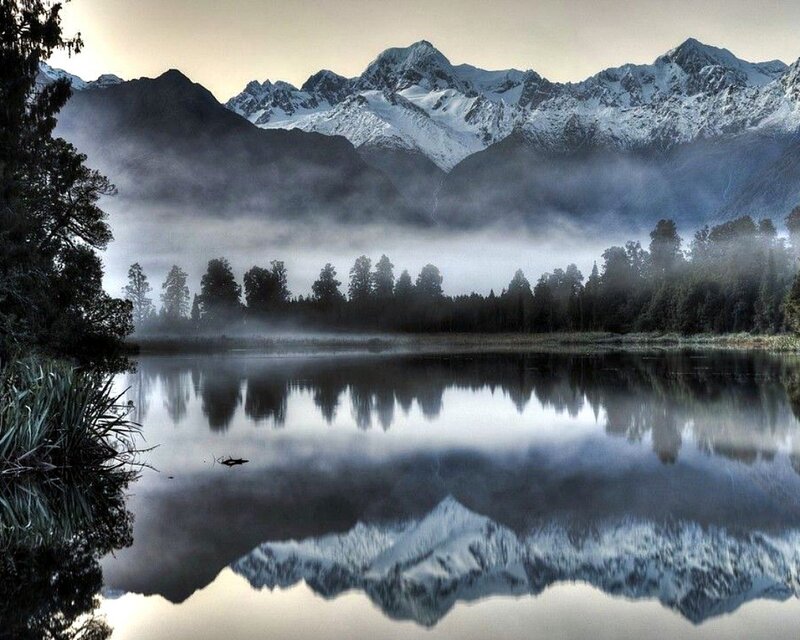 Misty mountain lake reflection