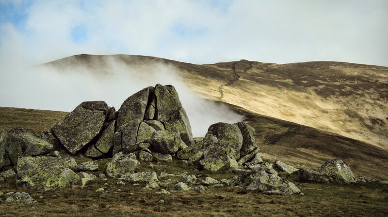 Misty mountain landscape with rocks