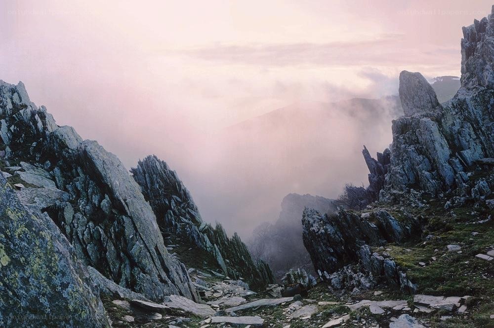 Misty mountain peaks at dawn