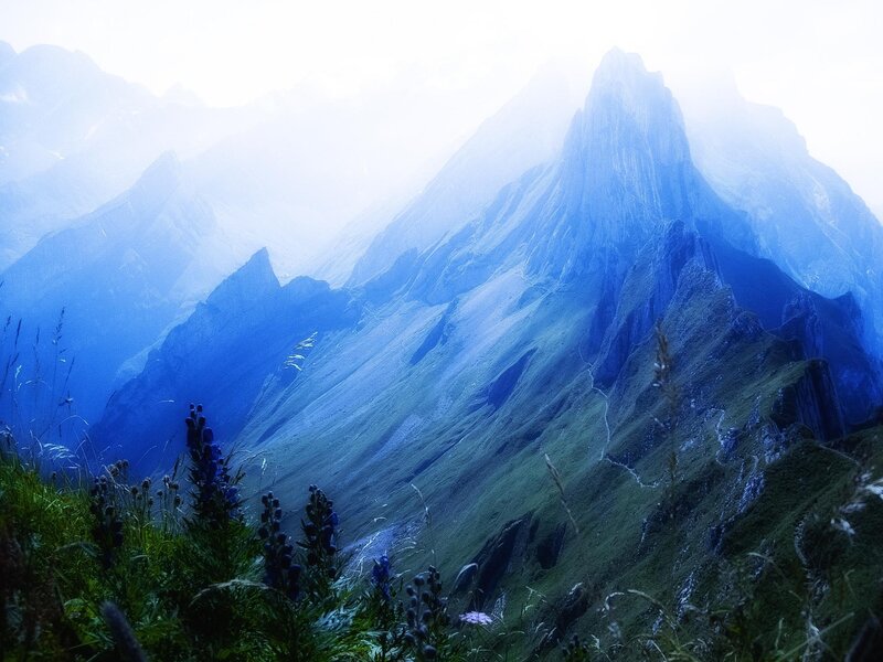 Misty mountain peaks at dawn