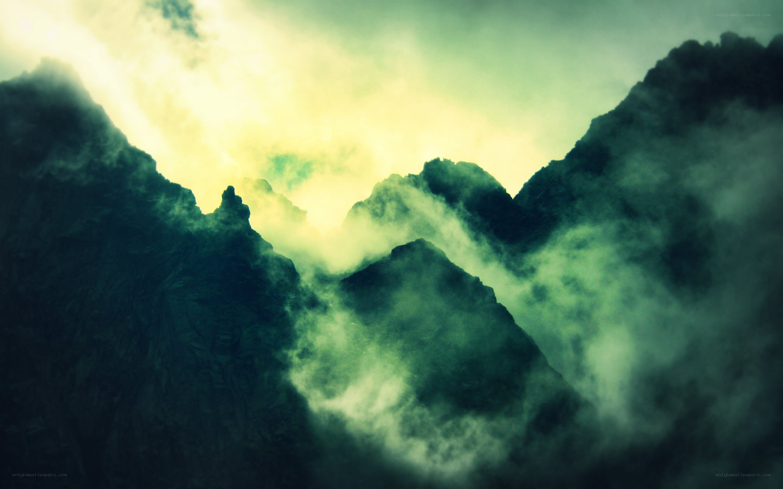 Misty mountain peaks at dawn