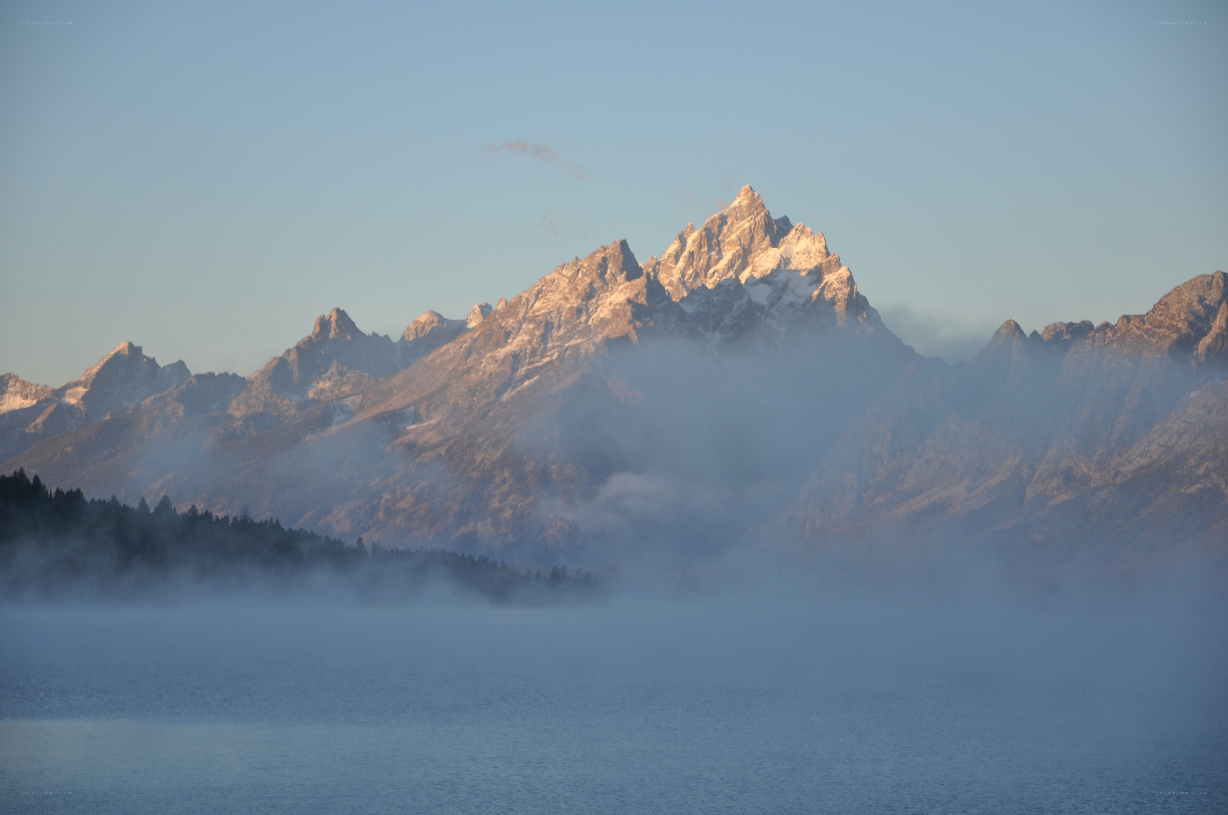 Misty mountain peaks at dawn