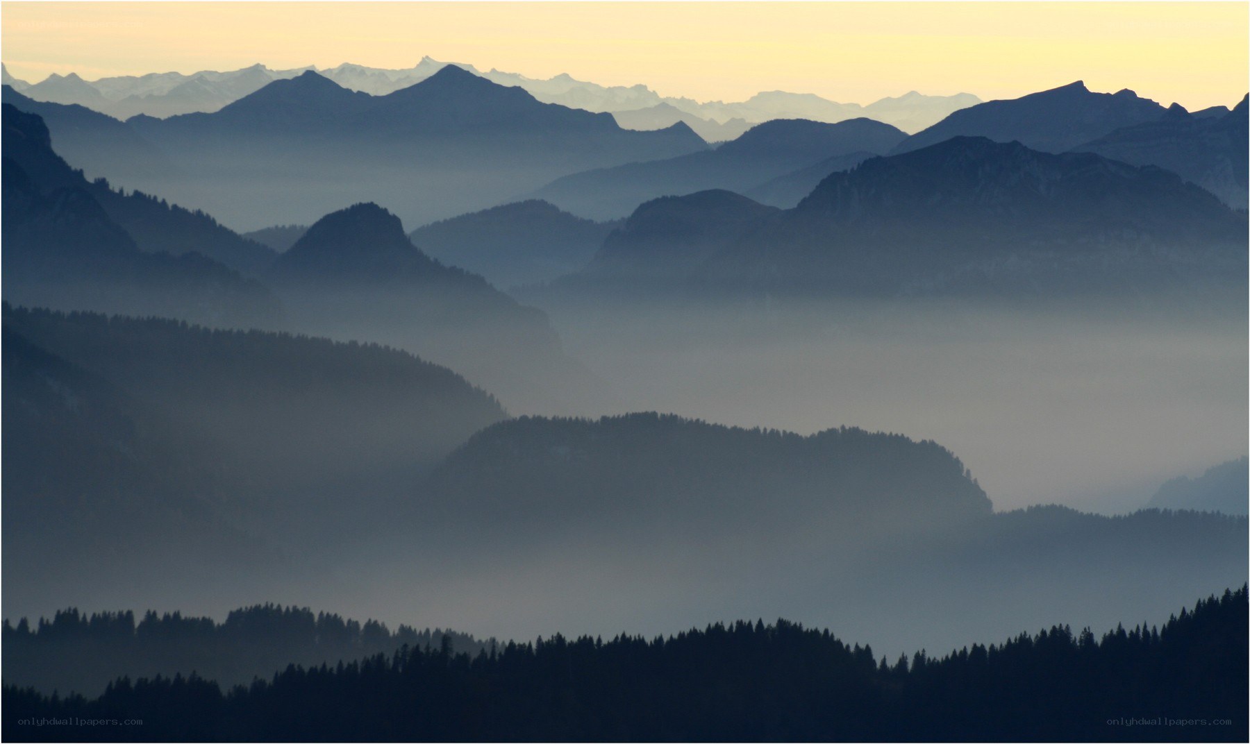 Misty mountain ranges at dawn