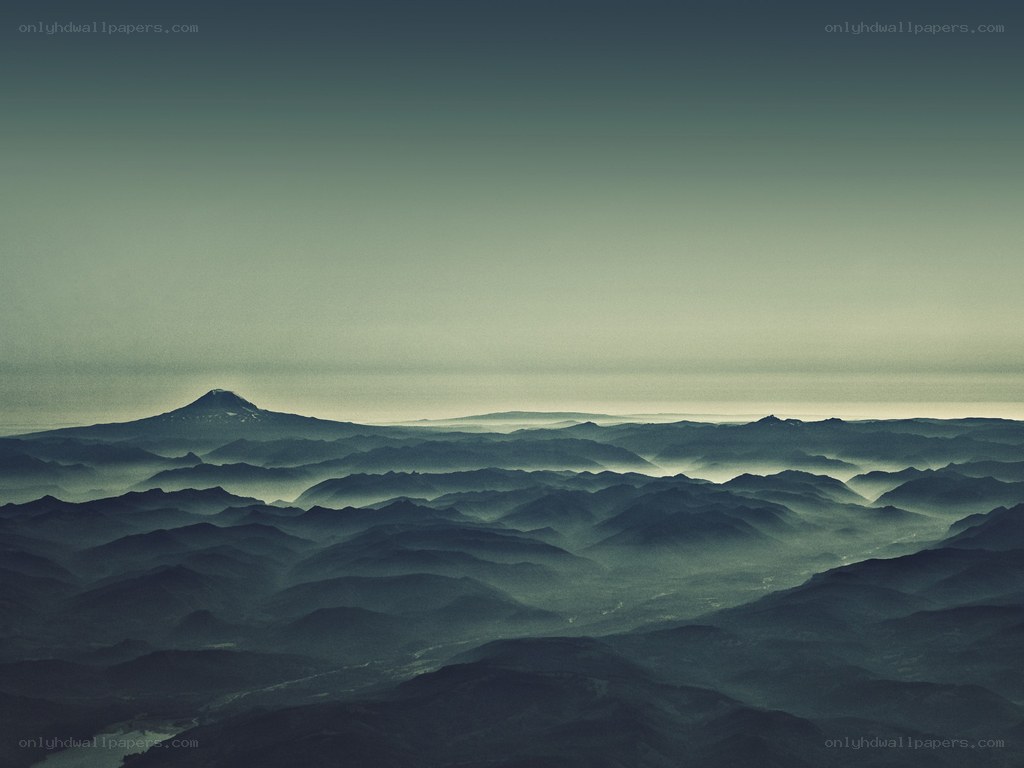 Misty mountain ranges at dawn