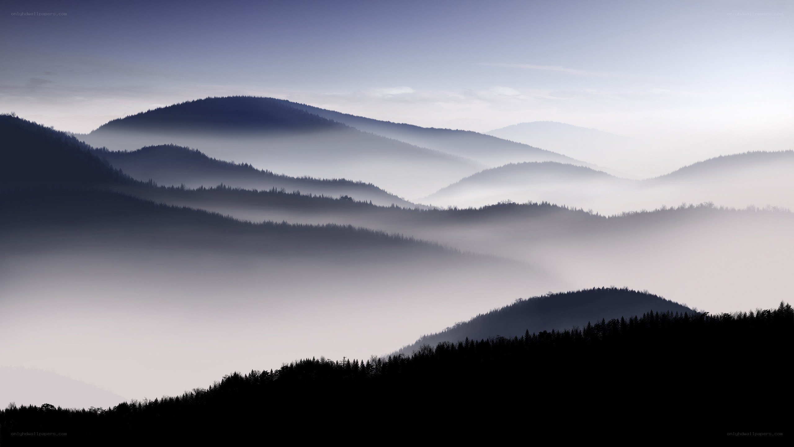 Misty mountain ranges at dawn