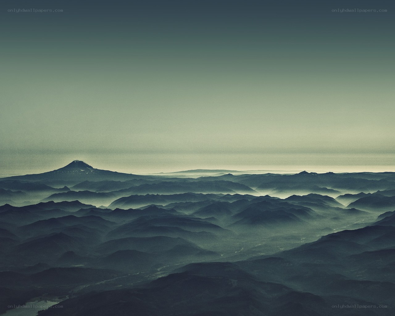 Misty mountain ranges at dawn