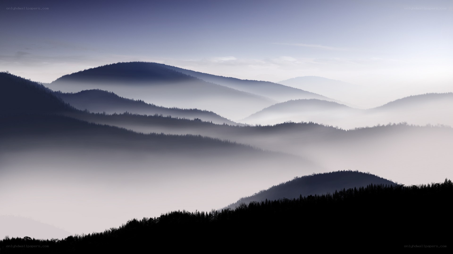Misty mountain ranges at dawn
