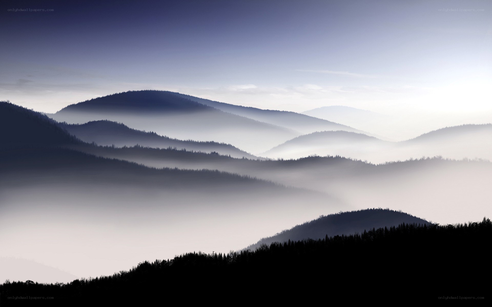 Misty mountain ranges at dawn