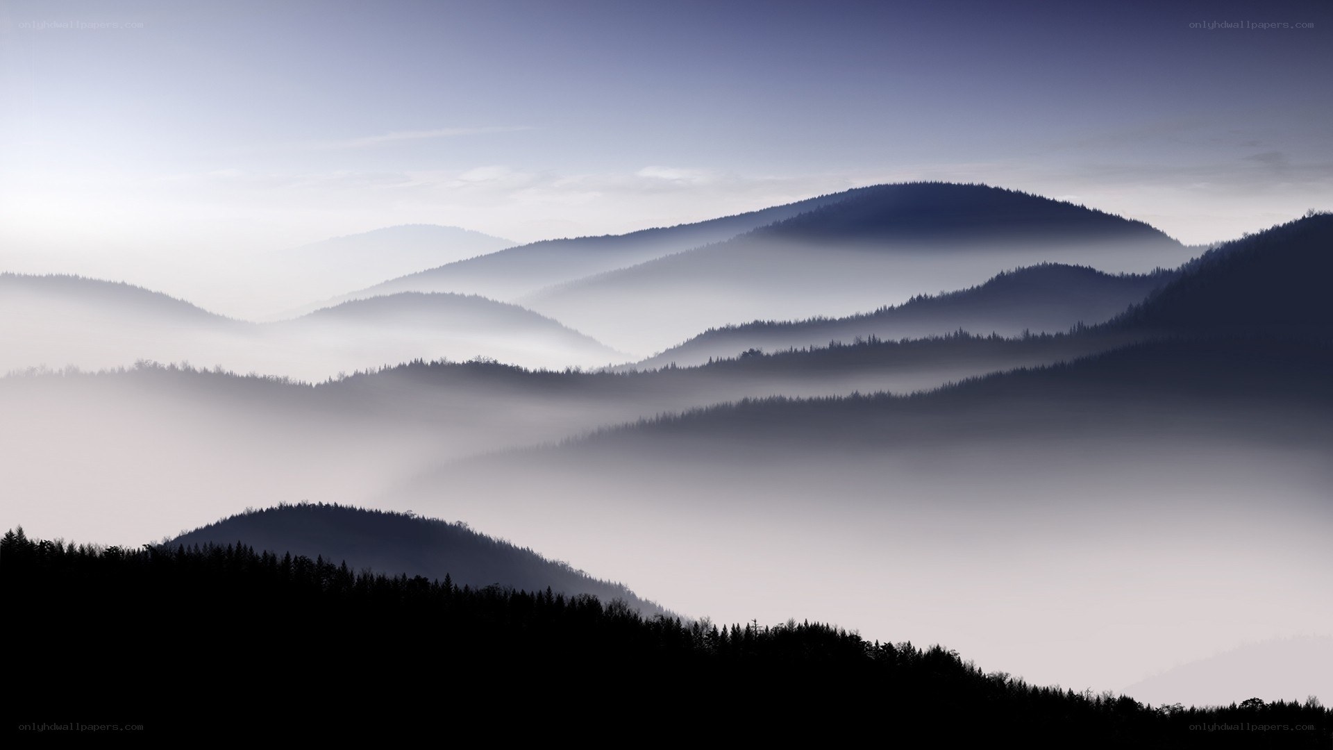 Misty mountain ranges at dawn