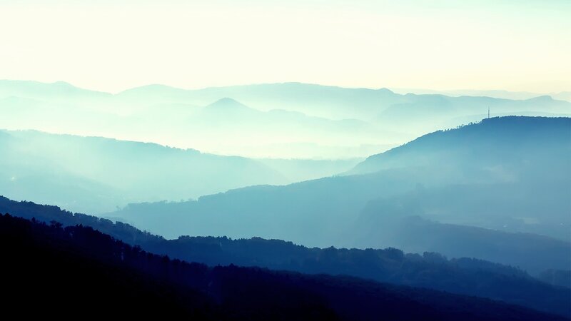 Misty mountain ranges at dawn