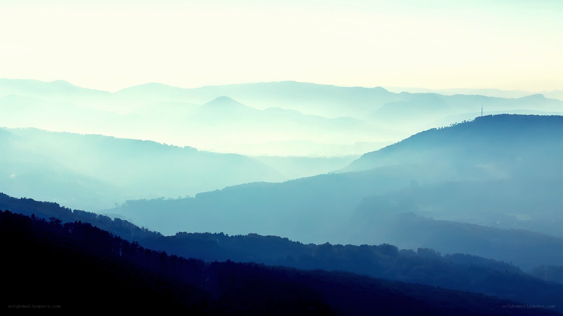 Misty mountain ranges at dawn